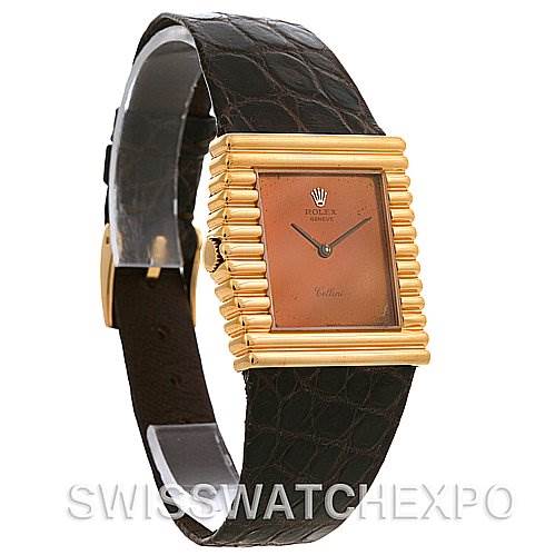 This image shows a Rolex Cellini 4015 Yellow Gold Brown Dial 4015 Yellow Gold Brown Dial watch at an angle, featuring its rectangular dial, gold bezel, and leather strap.