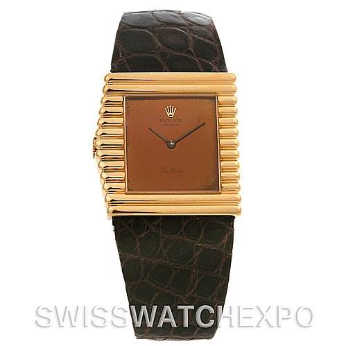 The image shows a front view of the Rolex Cellini 4015 Yellow Gold Brown Dial 4015 Yellow Gold Brown Dial watch, highlighting its square dial, distinctive gold bezel, and leather strap.