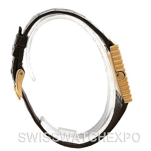 This image shows a side profile of a Rolex Cellini 4015 Yellow Gold Brown Dial 4015 Yellow Gold Brown Dial watch, highlighting the gold crown and the black leather strap.