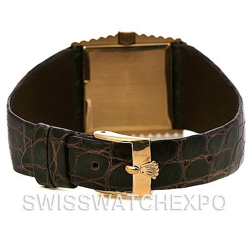 The image shows the back view of a Rolex Cellini 4015 Yellow Gold Brown Dial 4015 Yellow Gold Brown Dial watch, highlighting its gold clasp and leather strap.