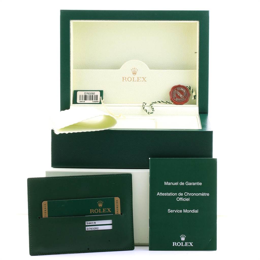 This image shows the packaging, warranty booklet, and authenticity card for a Rolex Cellini 5441 Men's White Gold Silver Dial 5441 Men's White Gold Silver Dial watch.
