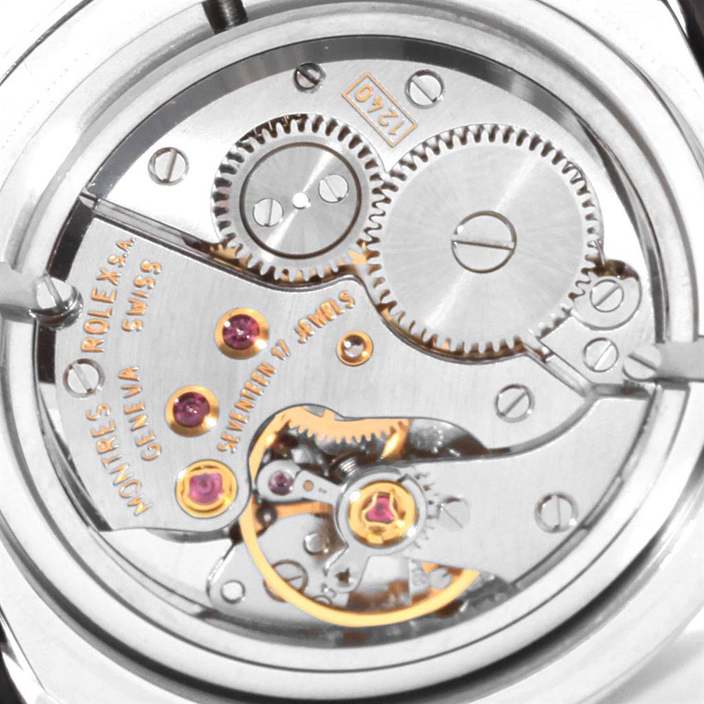 The image shows a close-up of the movement and inner mechanics of a Rolex Cellini 5240 Men's Platinum Mother of Pearl Dial 5240 Men's Platinum Mother of Pearl Dial watch, highlighting gears and jewels.
