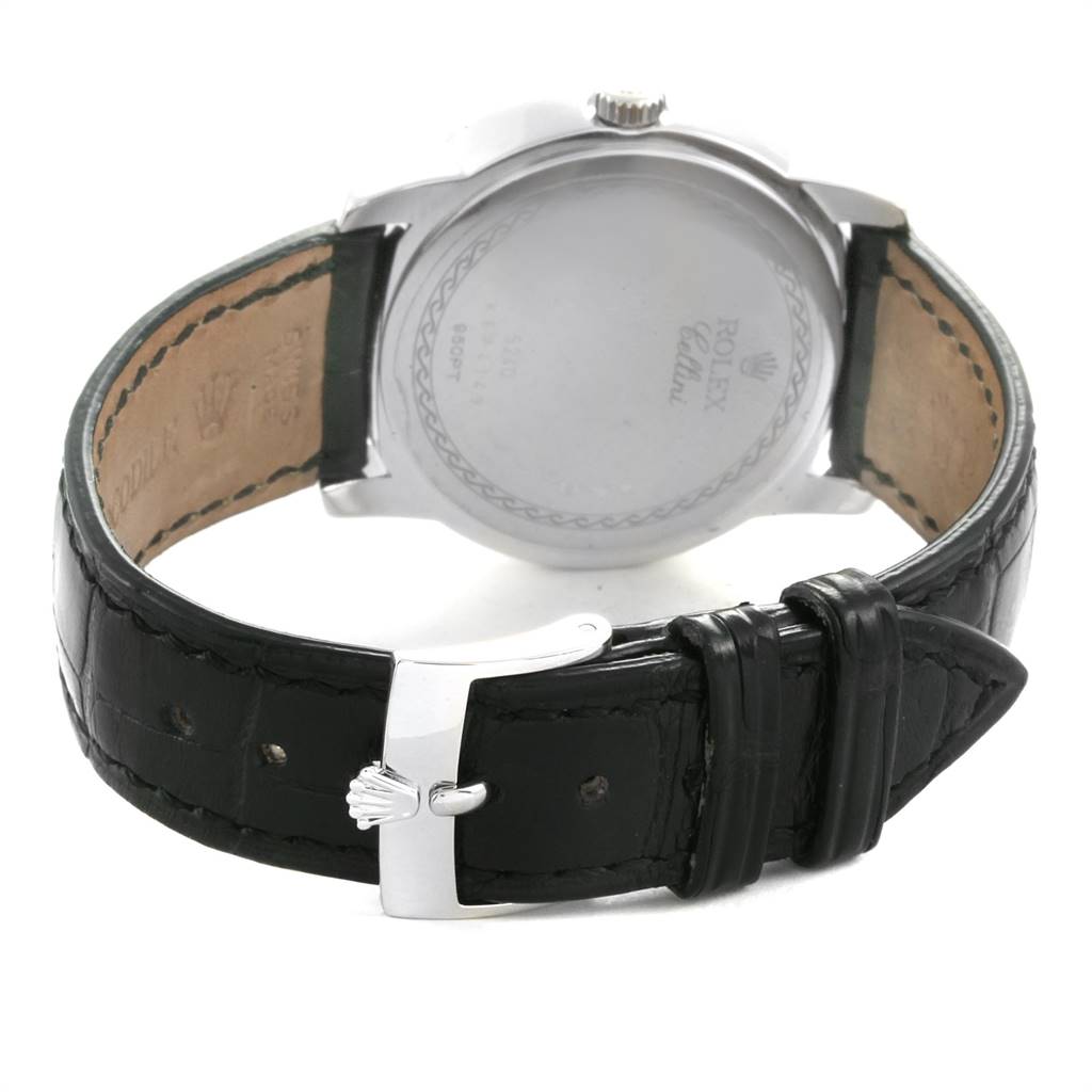 The image shows the back view of a Rolex Cellini 5240 Men's Platinum Mother of Pearl Dial 5240 Men's Platinum Mother of Pearl Dial watch with focus on its black leather strap and silver buckle.