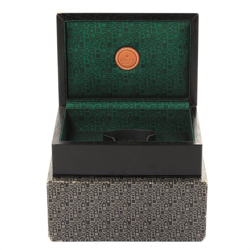 This image shows an open Rolex watch box for the Cellini model, featuring an intricate green interior and outer protective box.