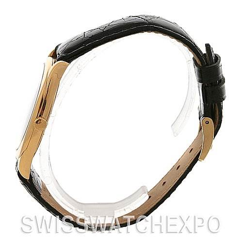 Side view of the Rolex Cellini 4233 Yellow Gold Black Dial 4233 Yellow Gold Black Dial showing the case, crown, and leather strap with buckle.