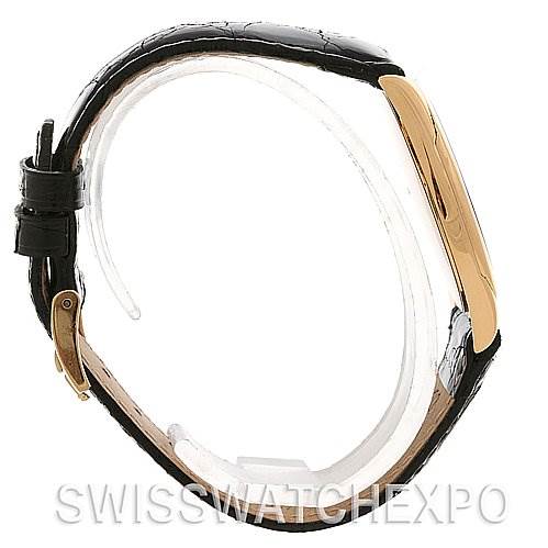 This side view shows the case, bezel, and strap of a Rolex Cellini 4233 Yellow Gold Black Dial 4233 Yellow Gold Black Dial watch.