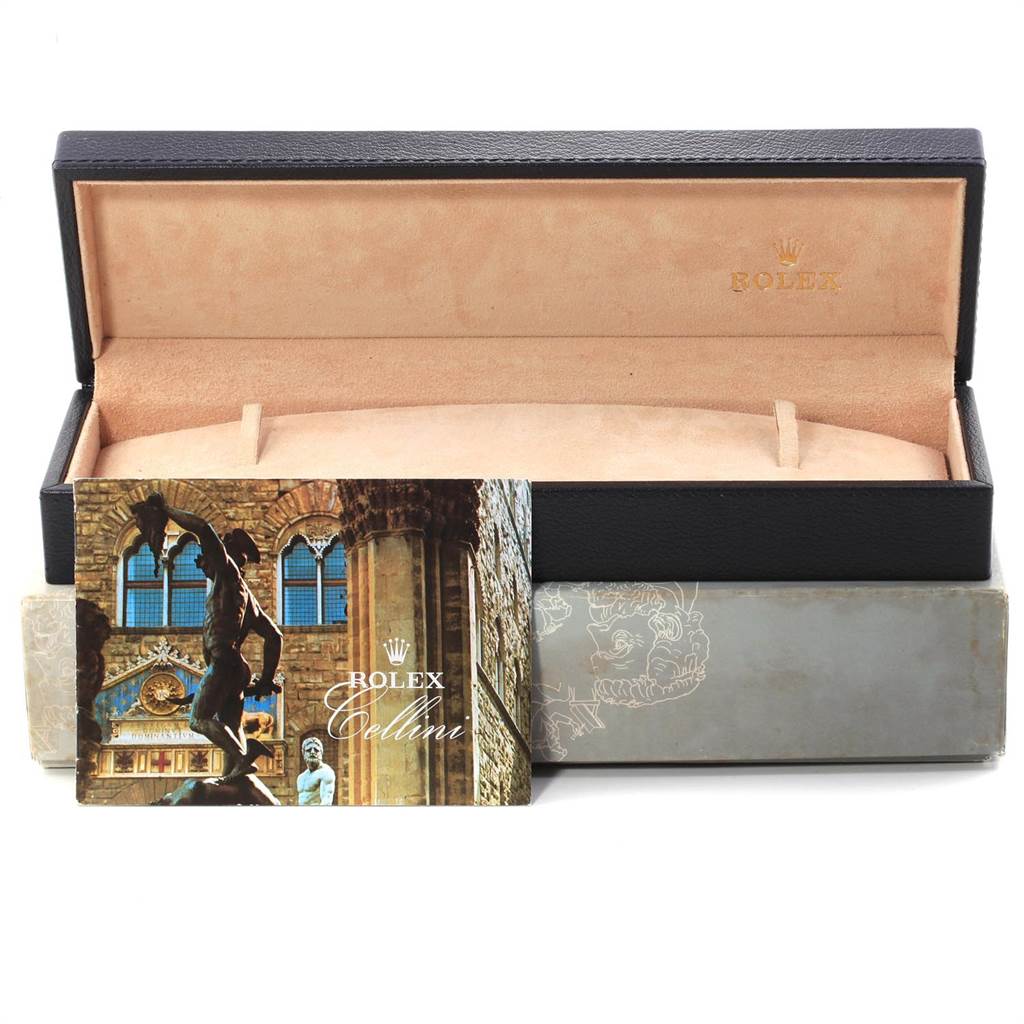 The image shows an open Rolex Cellini 4233 Men
s White Gold White Dial 4233 Men
s White Gold White Dial watch box along with a booklet and outer packaging.