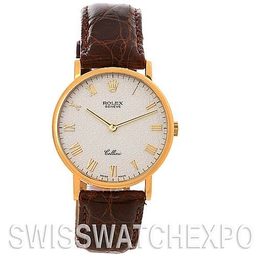 The Rolex Cellini 5112 Yellow Gold Beige Dial 5112 Yellow Gold Beige Dial watch is shown from a front angle, displaying the white dial, gold case, and brown leather strap.