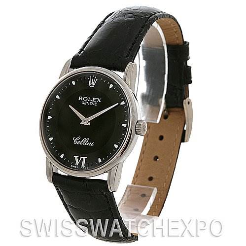 The Rolex Cellini 5116 White Gold Black Dial 5116 White Gold Black Dial watch is shown at a three-quarter angle, highlighting its black dial, silver casing, and leather strap.