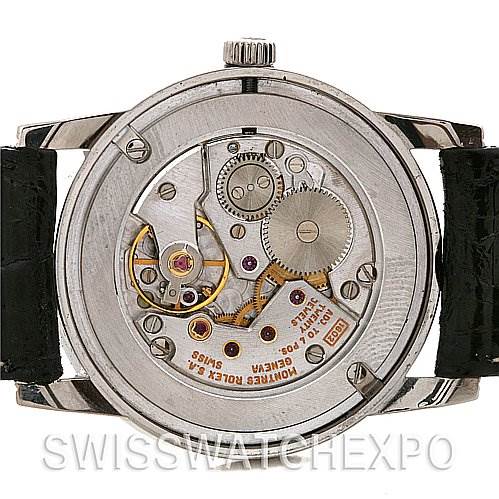 This image shows the back view of a Rolex Cellini 5116 White Gold Black Dial 5116 White Gold Black Dial watch, revealing its internal movement and mechanism.
