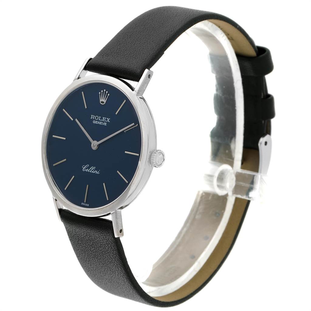 The image shows a side angle of the Rolex Cellini 4112 Men
s White Gold Blue Dial 4112 Men
s White Gold Blue Dial watch, displaying the watch face, case, and leather strap.