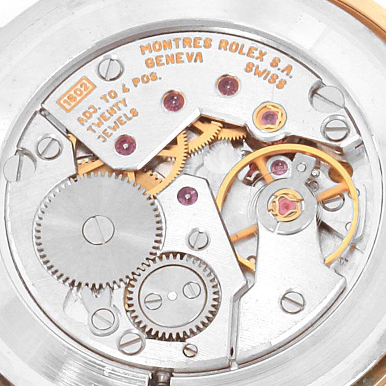 This image shows the intricate internal mechanisms and gears of the Rolex Cellini 4112 Men
s Yellow Gold White Dial 4112 Men
s Yellow Gold White Dial watch, viewed from the back.