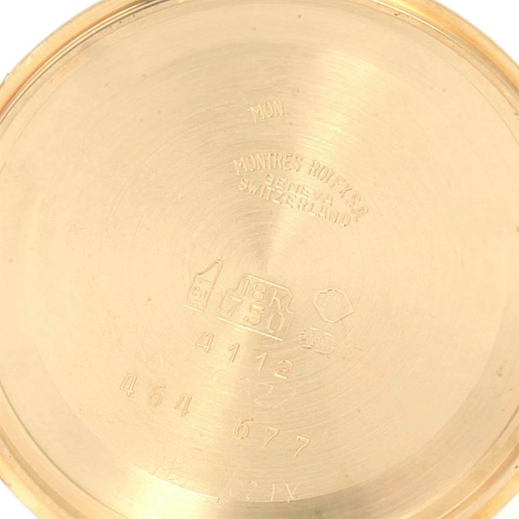 This image shows the inside back of a Rolex Cellini 4112 Men
s Yellow Gold White Dial 4112 Men
s Yellow Gold White Dial watch case, displaying engravings and hallmarks.
