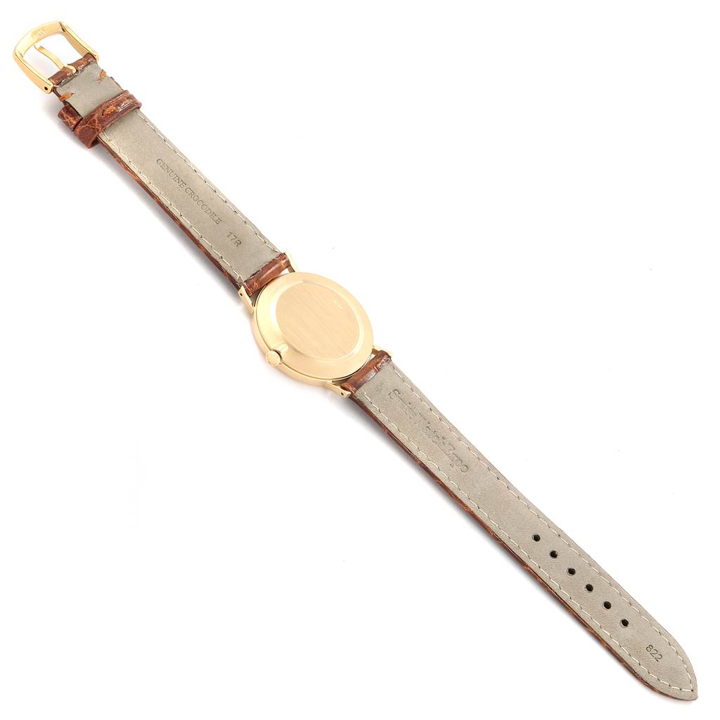 The image shows the back and full leather strap of a Rolex Cellini 4112 Men
s Yellow Gold White Dial 4112 Men
s Yellow Gold White Dial watch laid flat, displaying its clasp and buckle.