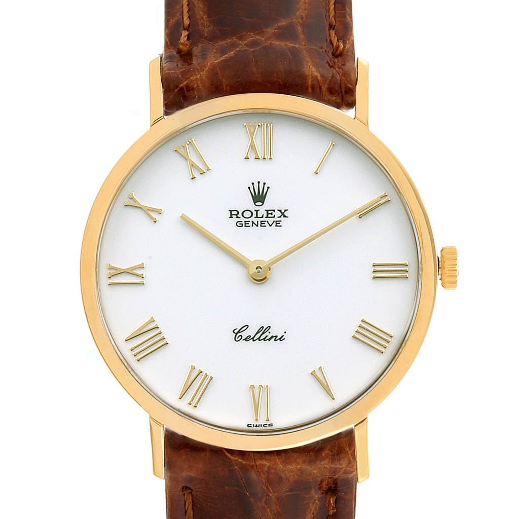 The image shows a front view of a Rolex Cellini 4112 Men
s Yellow Gold White Dial 4112 Men
s Yellow Gold White Dial watch featuring a round gold case, white dial with Roman numerals, and a brown leather strap.