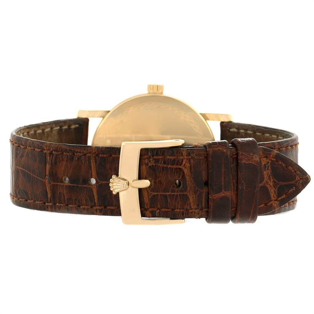 This image shows the back view of a Rolex Cellini 5115 Men's Yellow Gold Black Dial 5115 Men's Yellow Gold Black Dial watch, highlighting the leather strap and gold clasp.