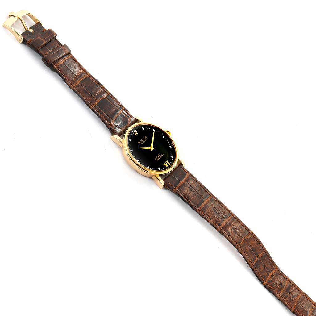 The image shows a full view of a Rolex Cellini 5115 Men's Yellow Gold Black Dial 5115 Men's Yellow Gold Black Dial model watch with a black dial and brown leather strap.