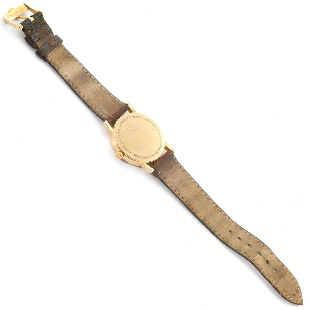 The image shows the back view of a Rolex Cellini 5115 Men's Yellow Gold Black Dial 5115 Men's Yellow Gold Black Dial watch, including the case, crown, strap, and buckle.