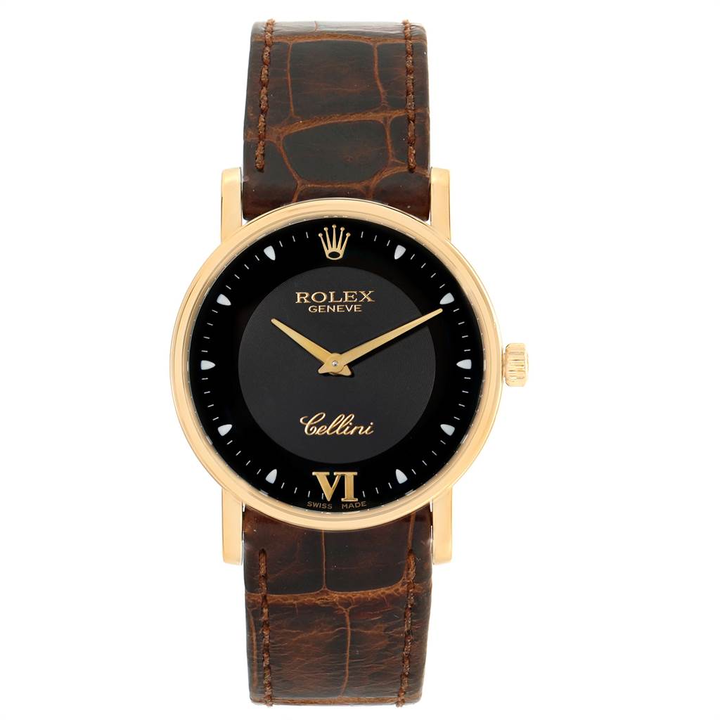 The Rolex Cellini 5115 Men's Yellow Gold Black Dial 5115 Men's Yellow Gold Black Dial watch is shown from a front angle, displaying its black dial, gold hands, and brown leather strap.
