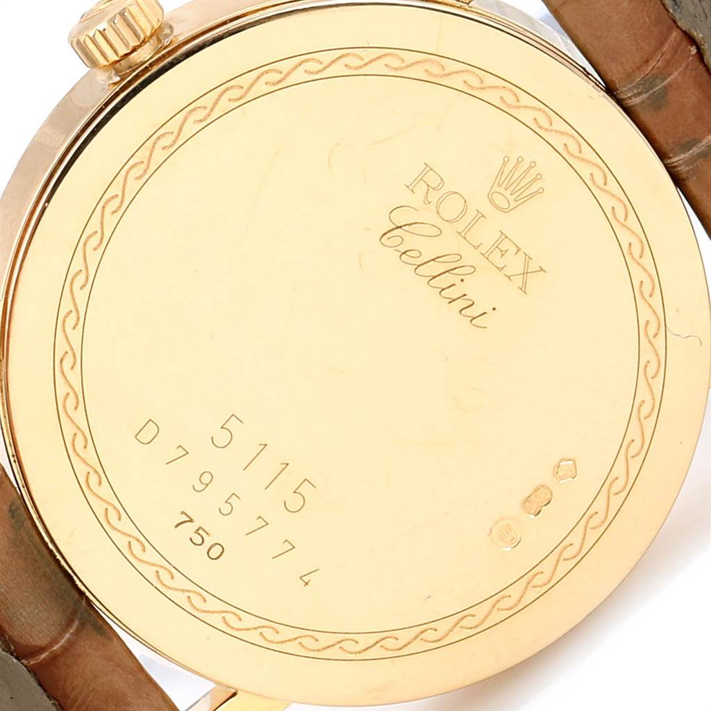 The image shows the back case of a Rolex Cellini 5115 Yellow Gold Mother of Pearl Dial 5115 Yellow Gold Mother of Pearl Dial watch, highlighting its serial number and hallmarks.
