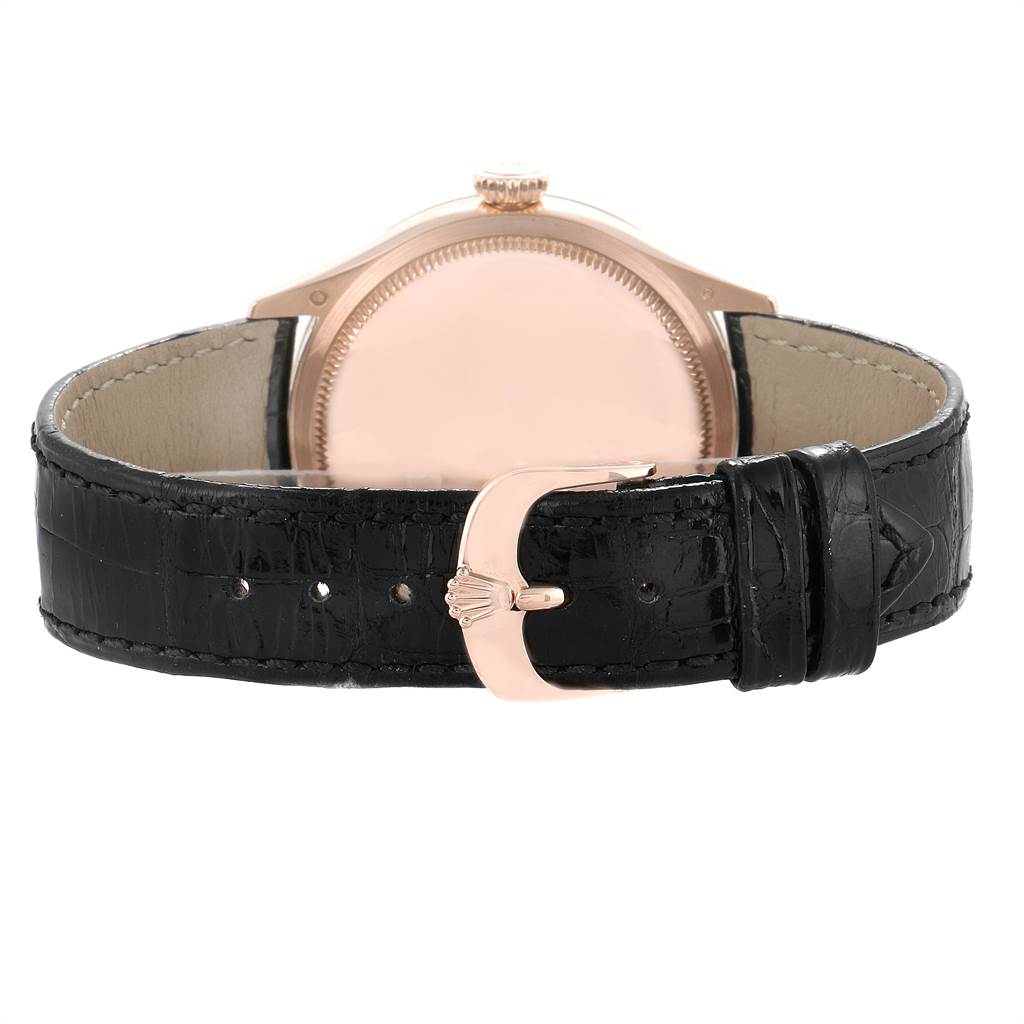 The image shows a rear view of a Rolex Cellini 50525 Men's Rose Gold Black Dial 50525 Men's Rose Gold Black Dial watch, highlighting its case back, crown, and black leather strap with a buckle.