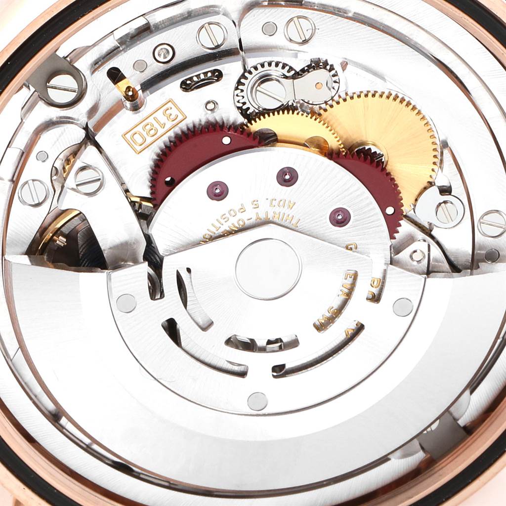 This image shows a close-up view of the movement mechanism inside a Rolex Cellini 50525 Men's Rose Gold Black Dial 50525 Men's Rose Gold Black Dial watch, highlighting gears and components.