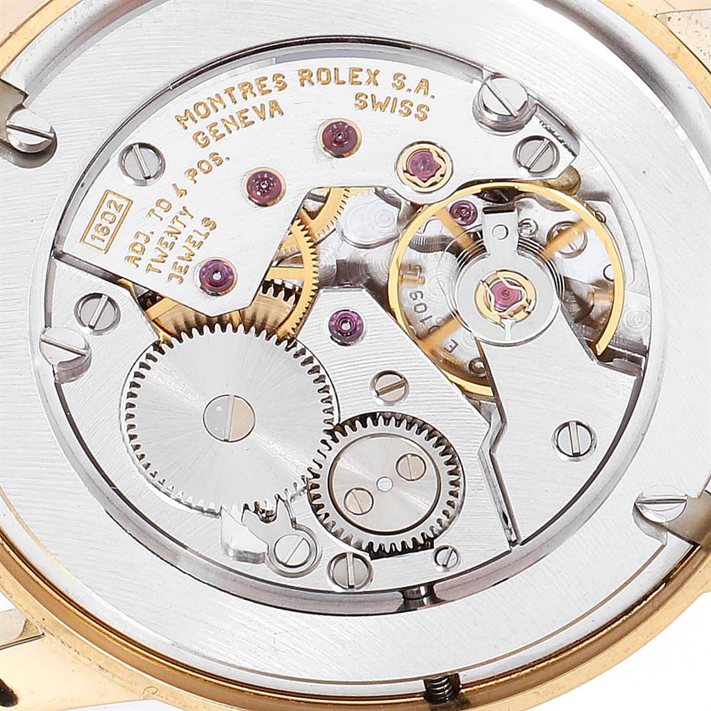 The image shows a close-up view of the Cellini model's Rolex watch movement and gears.