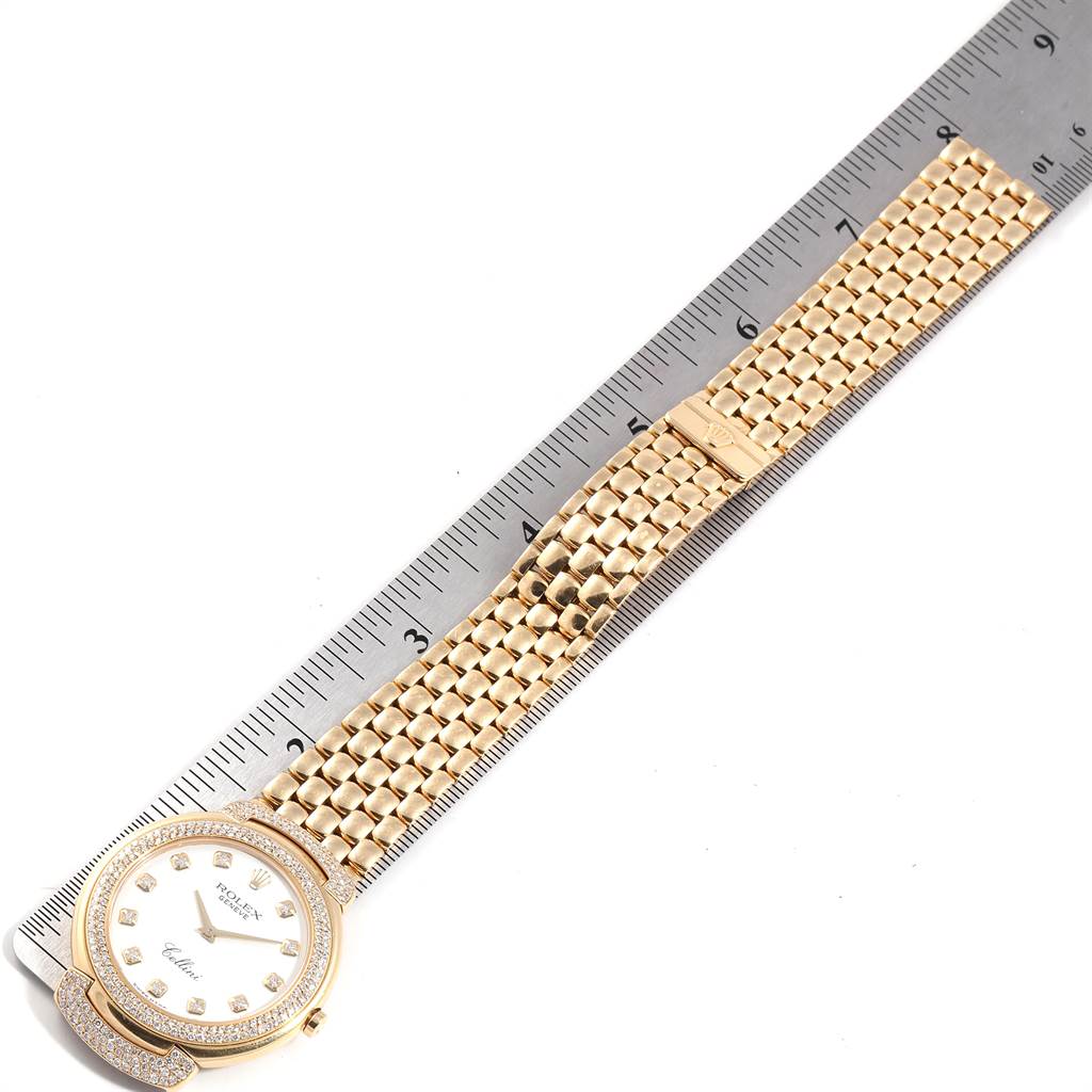 The image shows a top-down angle of a Rolex Cellini 6623 Men's Yellow Gold White Dial 6623 Men's Yellow Gold White Dial watch with its face and part of the bracelet aligned against a ruler.