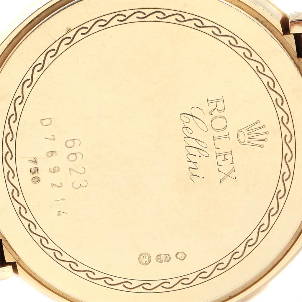The image shows the back of a Rolex Cellini 6623 Men's Yellow Gold White Dial 6623 Men's Yellow Gold White Dial watch, highlighting engravings and markings for authenticity.