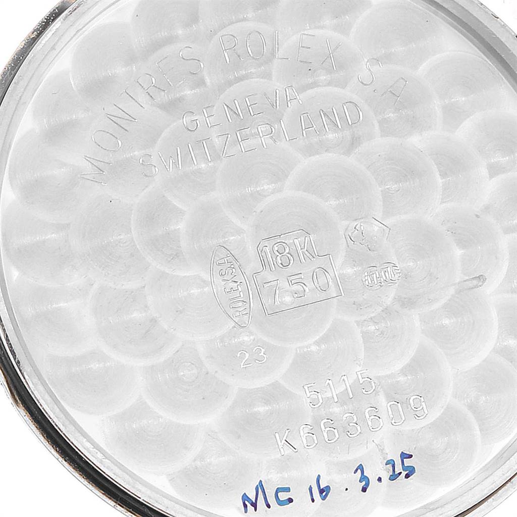 The image shows the inside of the case back of a Cellini model by Rolex, highlighting engravings detailing the watch’s specifications.