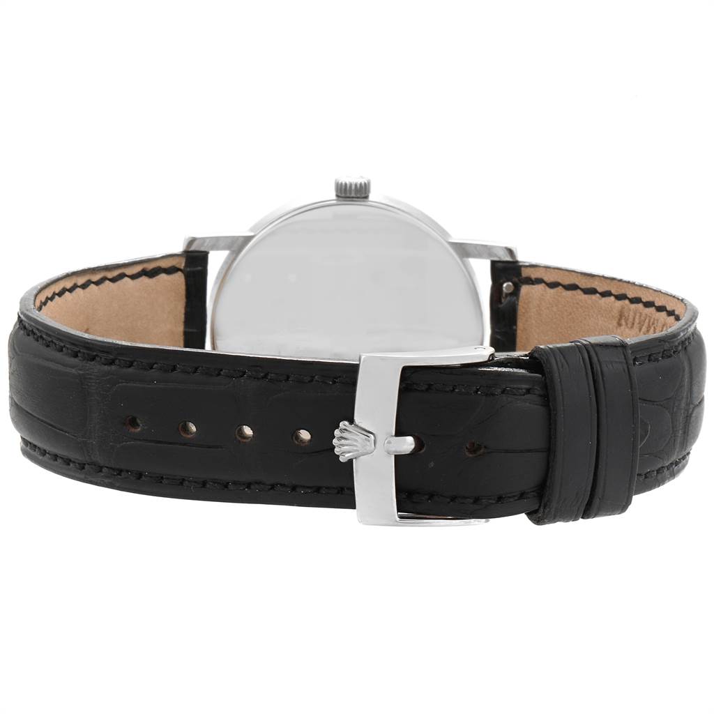 The image shows the back view of a Rolex Cellini 5115 Men
s White Gold Black Dial 5115 Men
s White Gold Black Dial watch, highlighting its black leather strap and buckle.