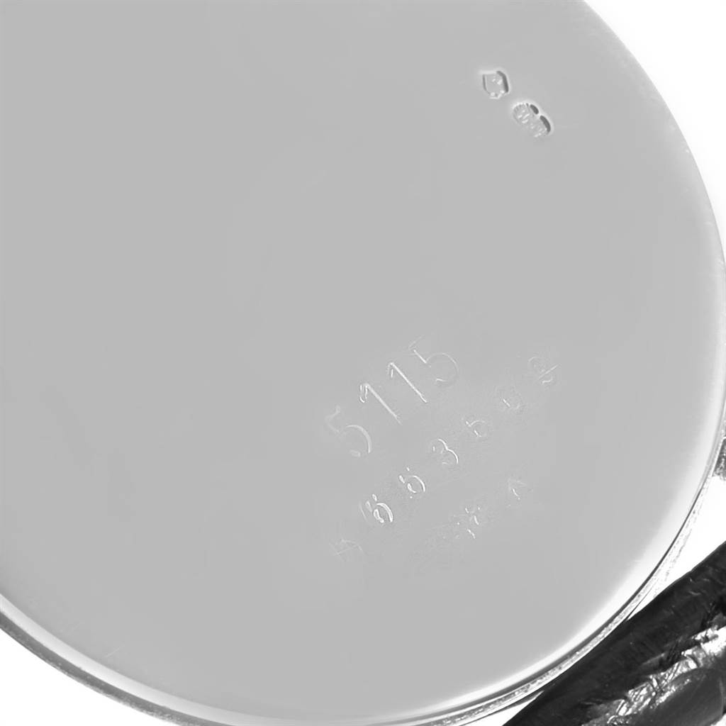 The image shows the engraved case back of a Rolex Cellini 5115 Men
s White Gold Black Dial 5115 Men
s White Gold Black Dial model, displaying the model and serial numbers.