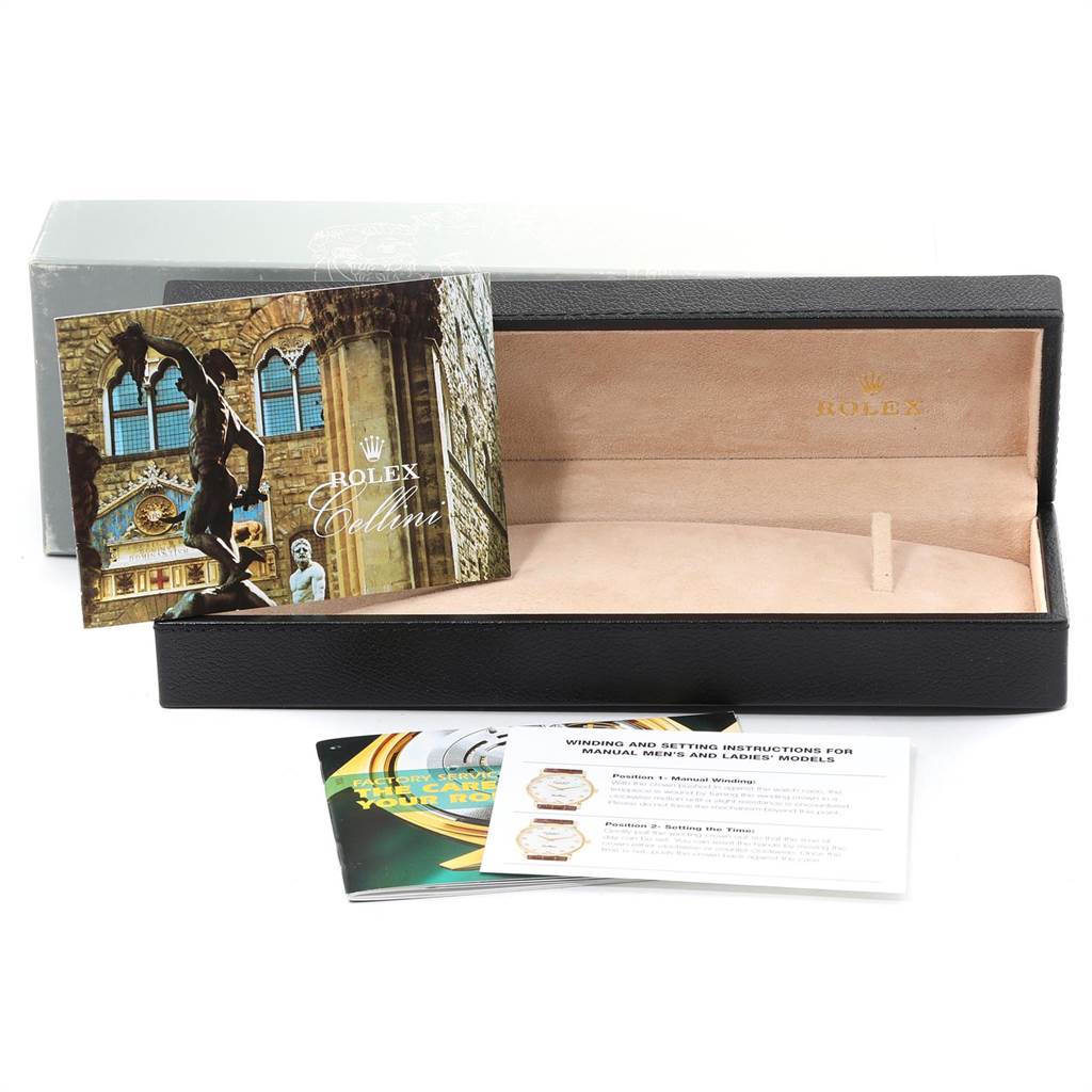 The image shows a Rolex Cellini 5115 Men
s White Gold Black Dial 5115 Men
s White Gold Black Dial watch box, an instruction booklet, and additional documents.