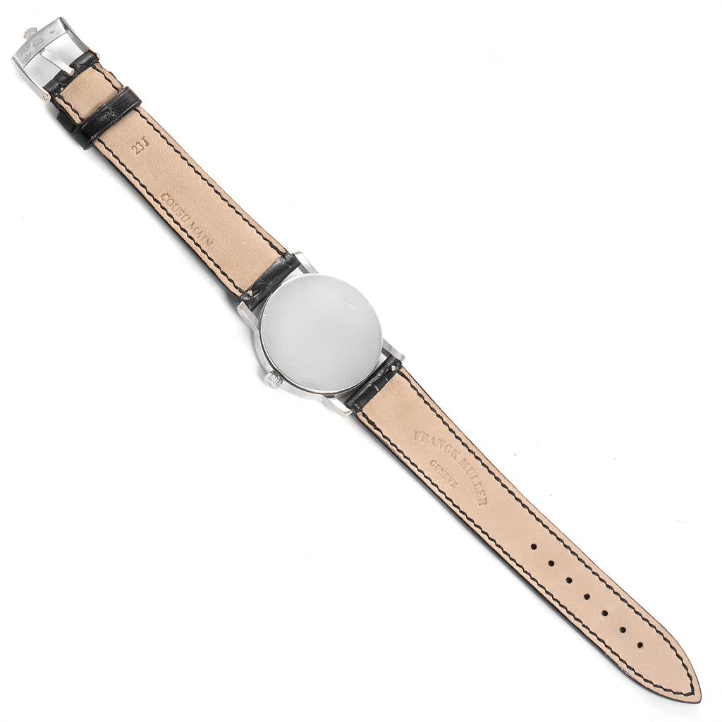 The image shows the back view of a Rolex Cellini 5115 Men
s White Gold Black Dial 5115 Men
s White Gold Black Dial watch, including the leather strap and stainless steel case back.