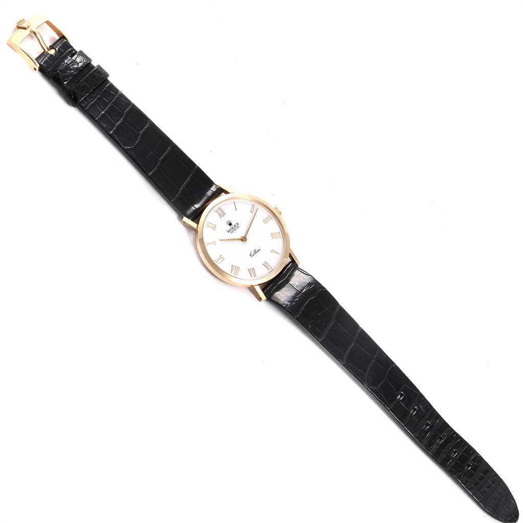 The watch in the image is a Rolex Cellini 4112 Men's Yellow Gold White Dial 4112 Men's Yellow Gold White Dial model shown from a top-down angle, displaying its face, strap, and buckle.