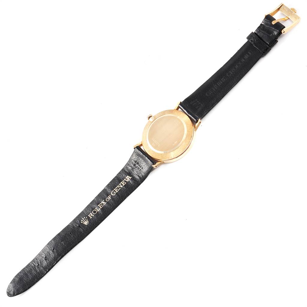 The image shows the back view of a Rolex Cellini 4112 Men's Yellow Gold White Dial 4112 Men's Yellow Gold White Dial watch with its black leather strap fully extended.