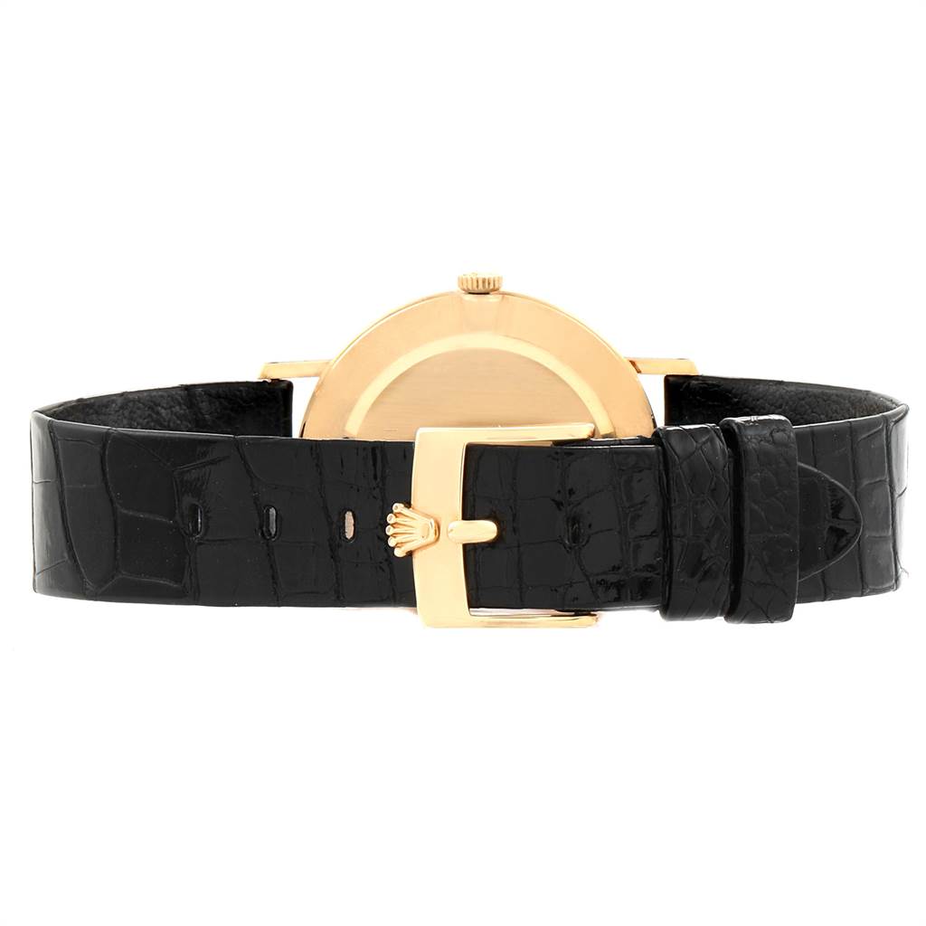 This image shows the back view of a Rolex Cellini 4112 Men's Yellow Gold White Dial 4112 Men's Yellow Gold White Dial watch, highlighting the black leather strap and gold clasp.