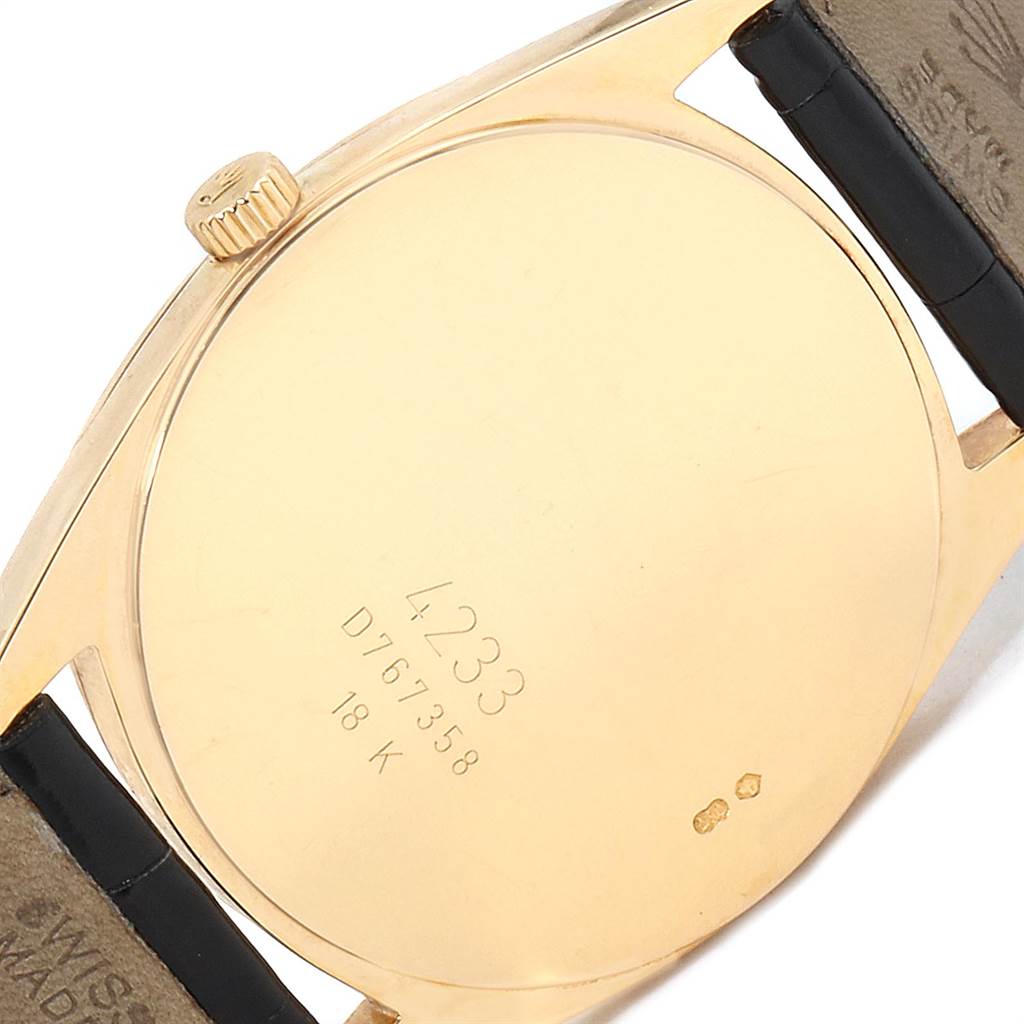 The image shows the back of a Rolex Cellini 4233 Men's Yellow Gold White Dial 4233 Men's Yellow Gold White Dial watch, displaying the case back, crown, and portions of the strap.