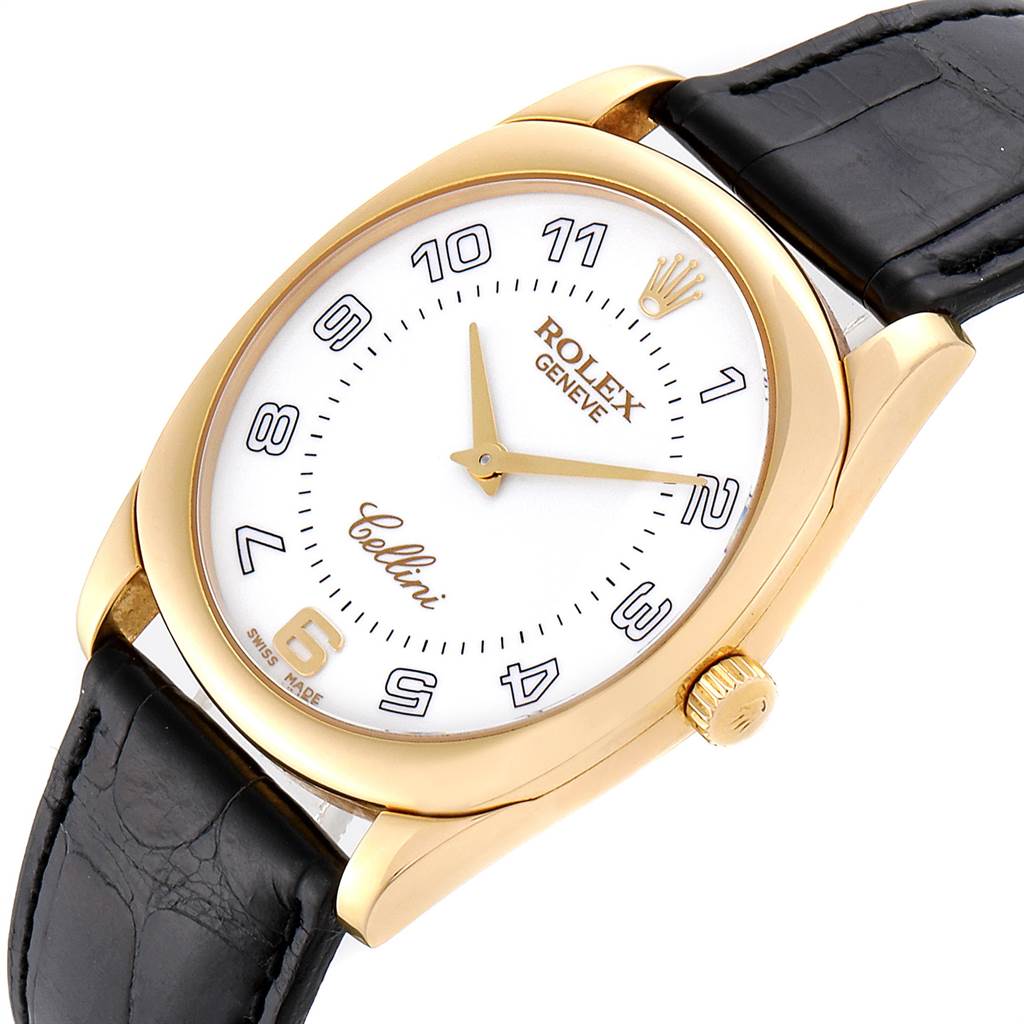The image showcases a Rolex Cellini 4233 Men's Yellow Gold White Dial 4233 Men's Yellow Gold White Dial watch from a slightly elevated angle, focusing on the face, gold bezel, and black leather strap.