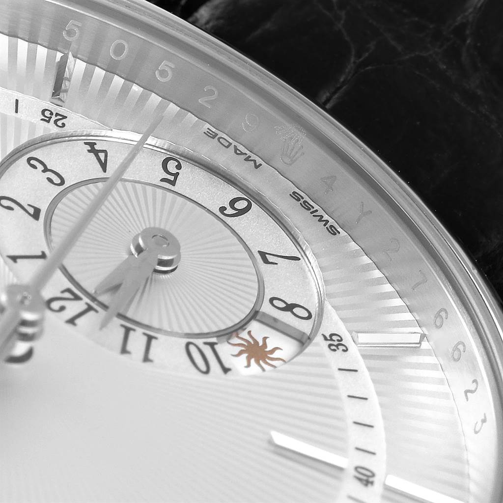 The image shows a close-up of the dial and part of the bezel of the Rolex Cellini 50529 Men
s White Gold Silver Dial 50529 Men
s White Gold Silver Dial watch, highlighting its intricate design and numerals.