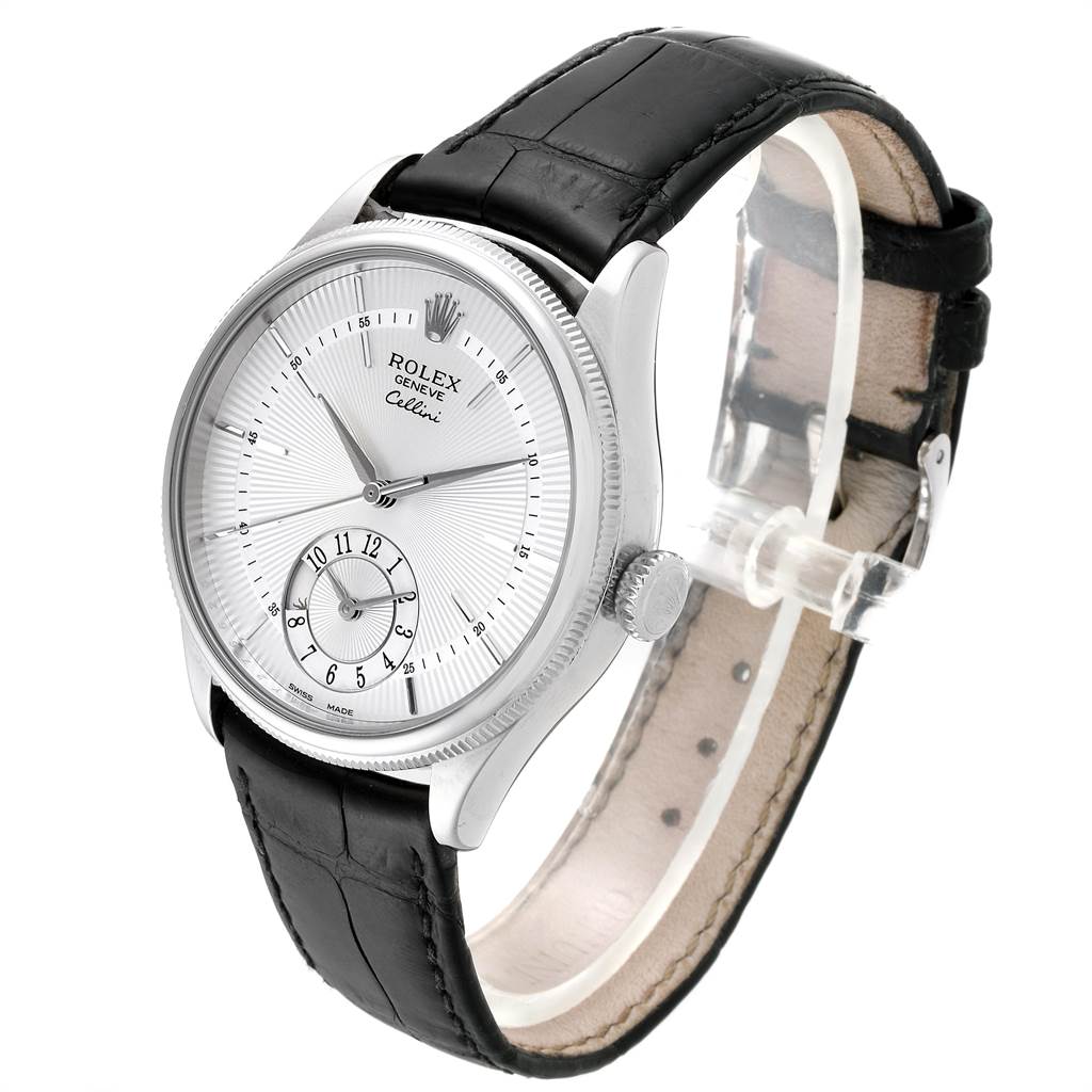 The image shows a Rolex Cellini 50529 Men
s White Gold Silver Dial 50529 Men
s White Gold Silver Dial watch at a 3/4 angle, highlighting its face, bezel, crown, and leather strap.