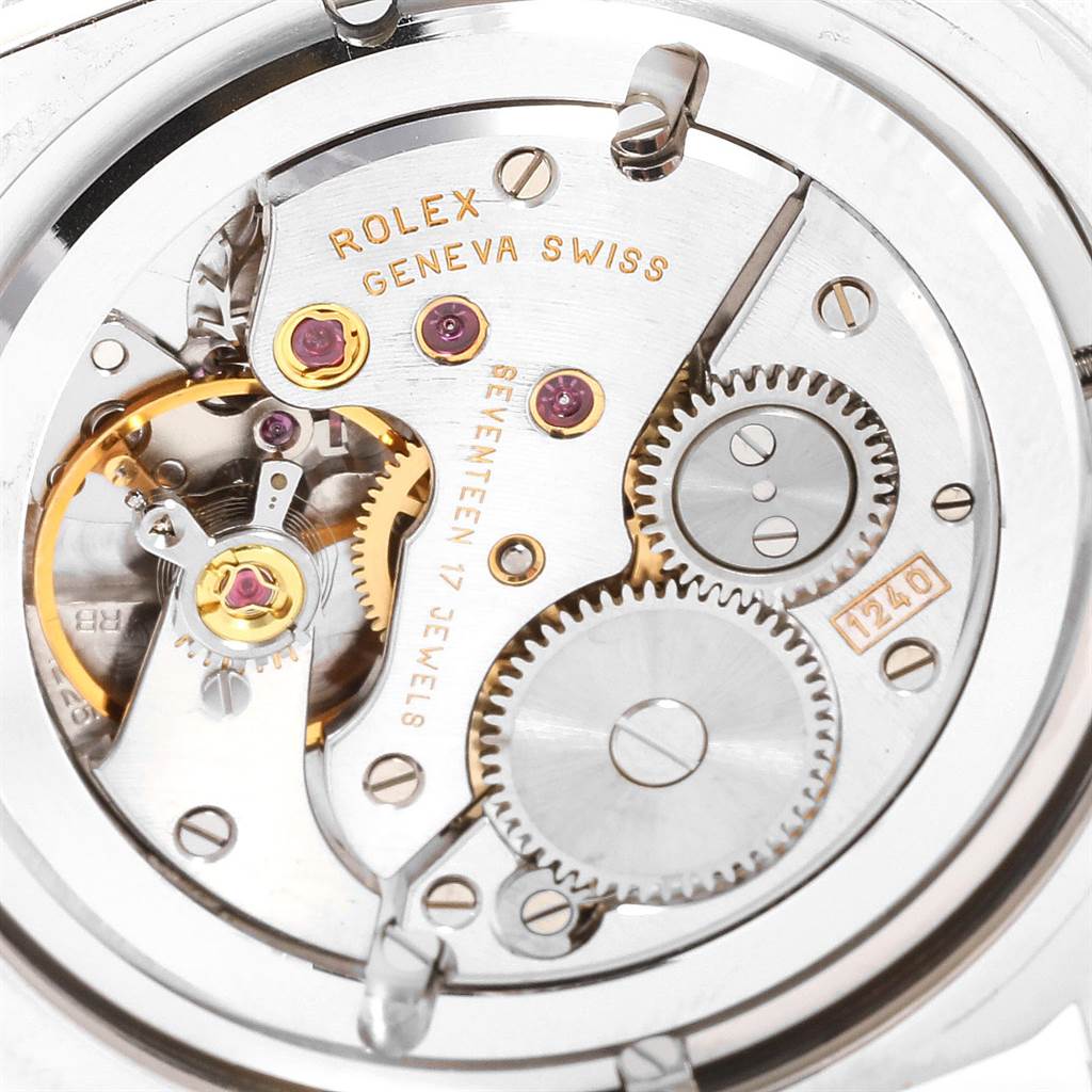 This image shows the intricate inner mechanism and movement of a Rolex Cellini 5241 Men's Platinum Black Dial 5241 Men's Platinum Black Dial watch, highlighting gears and jewels.