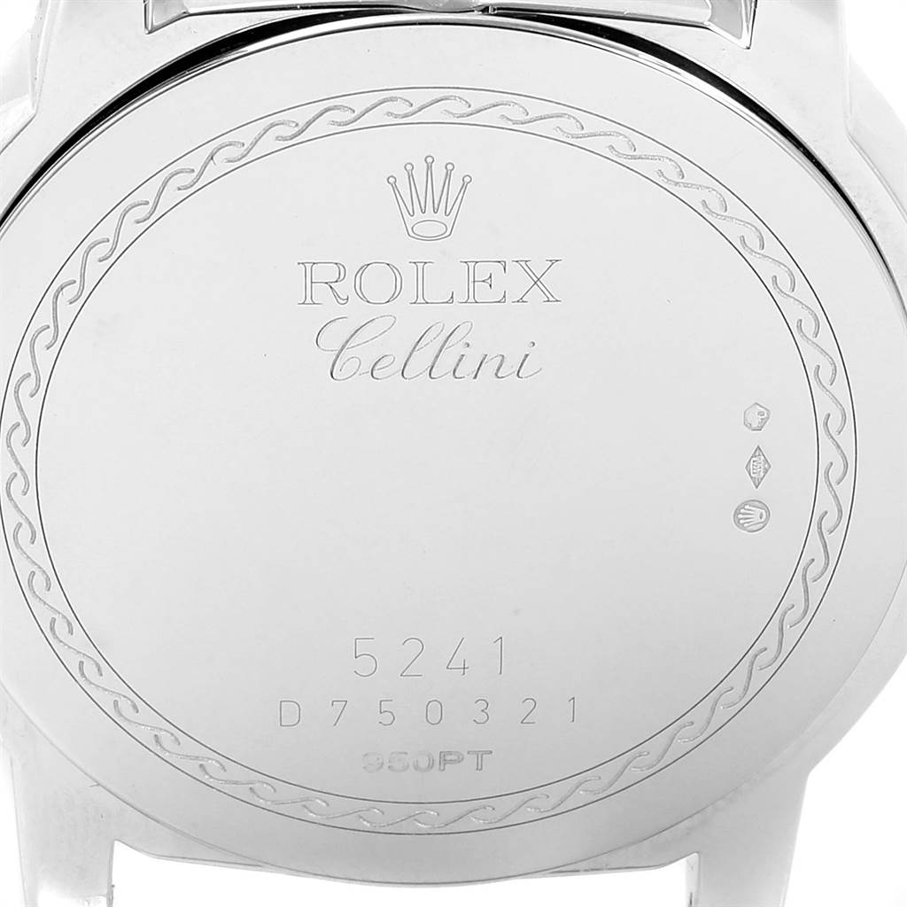 The image shows the case back of a Rolex Cellini 5241 Men's Platinum Black Dial 5241 Men's Platinum Black Dial watch with engravings and serial numbers.