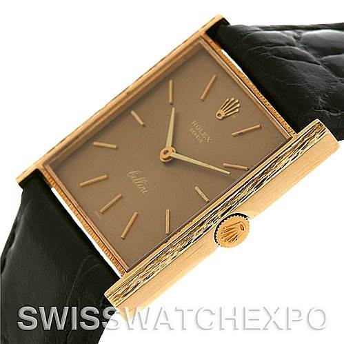 The image shows a close-up of a Rolex Cellini 4014 Men's Yellow Gold Brown Dial 4014 Men's Yellow Gold Brown Dial watch, highlighting the rectangular face, crown, and leather strap.