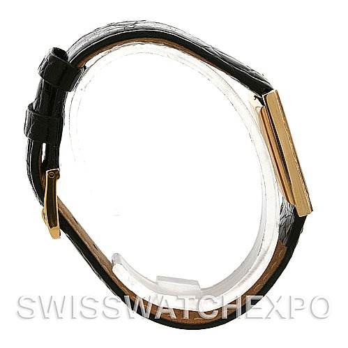 The image shows a side view of a Rolex Cellini 4014 Men's Yellow Gold Brown Dial 4014 Men's Yellow Gold Brown Dial watch, featuring a black leather strap and a rectangular gold case.