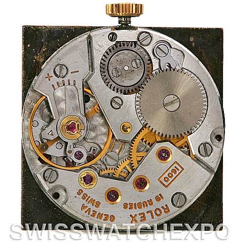 This image shows the internal mechanism of a Rolex Cellini 4014 Men's Yellow Gold Brown Dial 4014 Men's Yellow Gold Brown Dial watch viewed from the back, focusing on the movement and gears.