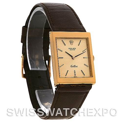 This image shows a side-front angle of a Rolex Cellini 4014 Men
s Yellow Gold Champagne Dial 4014 Men
s Yellow Gold Champagne Dial watch, highlighting its square dial, gold case, and brown leather strap.