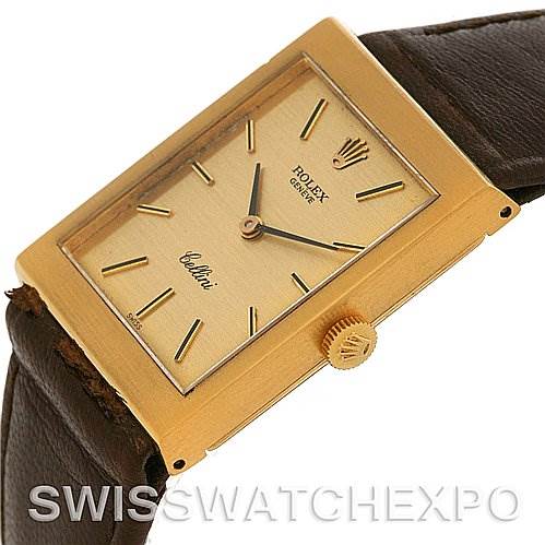 The image shows a gold-tone Rolex Cellini 4014 Men
s Yellow Gold Champagne Dial 4014 Men
s Yellow Gold Champagne Dial watch with a rectangular face, leather strap, and visible crown from a slightly angled side view.