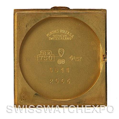 This is the inside of the case back of a Rolex Cellini 4014 Men
s Yellow Gold Champagne Dial 4014 Men
s Yellow Gold Champagne Dial model watch, showing various engravings and markings.