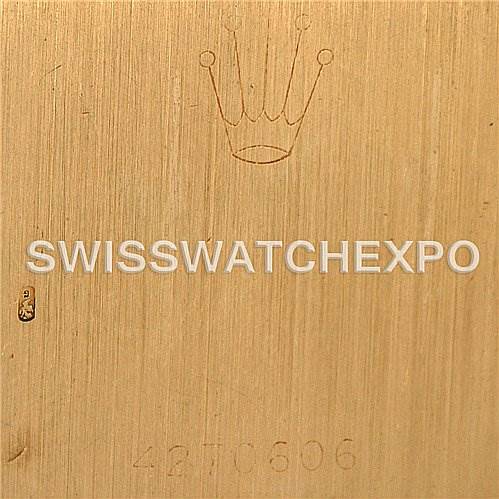 This image shows the backplate of a Rolex Cellini 4014 Men
s Yellow Gold Champagne Dial 4014 Men
s Yellow Gold Champagne Dial watch, featuring the Rolex crown logo and serial number.